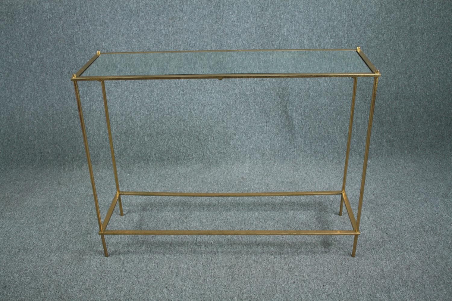 Console table, gilt metal frame with mirrored top. H.80 W.107 D.32cm.
