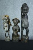 Three carved hardwood figures. Tribal art. H.74cm. (largest)