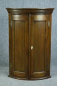 Hanging corner cabinet, contemporary in the Georgian style. H.93 W.63cm.