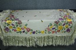 A Victorian French silk embroidered floral design bed throw with silk tassel edging. L.140 W.130cm.