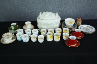 A large collection of mixed pottery. Including tea and coffee cups, plates and a lidded pot. Made by