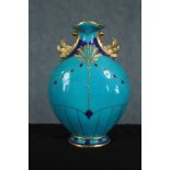 Minton's pottery. An ornate blue teal vase with hand painted gilt decoration. Egyptian revival.