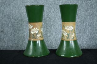 A matching pair of ceramic vases with embossed decoration. Stamp made in England. Twentieth century.