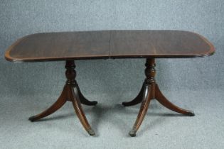 Dining table, Georgian style mahogany and crossbanded with satinwood string inlay. Twin pedestal