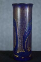 A blue glass oil slick vase with a gilt finish. Maybe Isle of White studio glass but without a