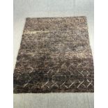 A contemporary hand made woollen Eastern carpet. L.243 W.207cm.