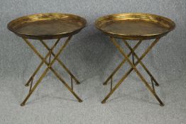 A pair of gilt metal folding serving tables. H.65 Dia.66cm. (each)