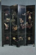 A lacquered Chinese full height four panelled screen with applied hardstone decoration. H.183 W.