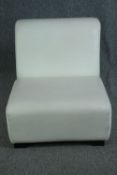 A Viccarbe low white salon or child's chair in leather upholstery. H.58cm.