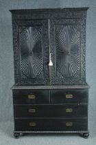 Linen press, Anglo Indian 19th century carved hardwood, in two sections. H.206 W.125 W.61cm.