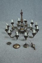 A large Dutch style metal ceiling chandelier with twelve scrolling branches. H.65 Dia.90cm.