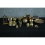 A collection of various brass items including a picture frame, trinket boxes and a wine holder. H.20