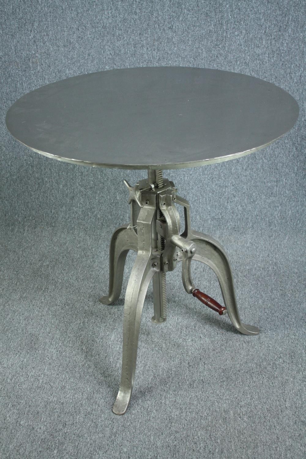 A metal industrial style table with hand winding rise and fall action. Dia.77cm. - Image 4 of 7