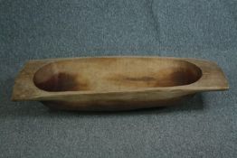 A large carved wooden dough trough. H.10 W.110 D.42 cm.