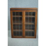Bookcase, mid century oak with leaded glass doors. H.110 W.90 D.27cm.