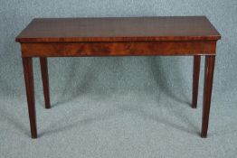 Console or serving table, Georgian style flame mahogany on square section tapering supports. H.74