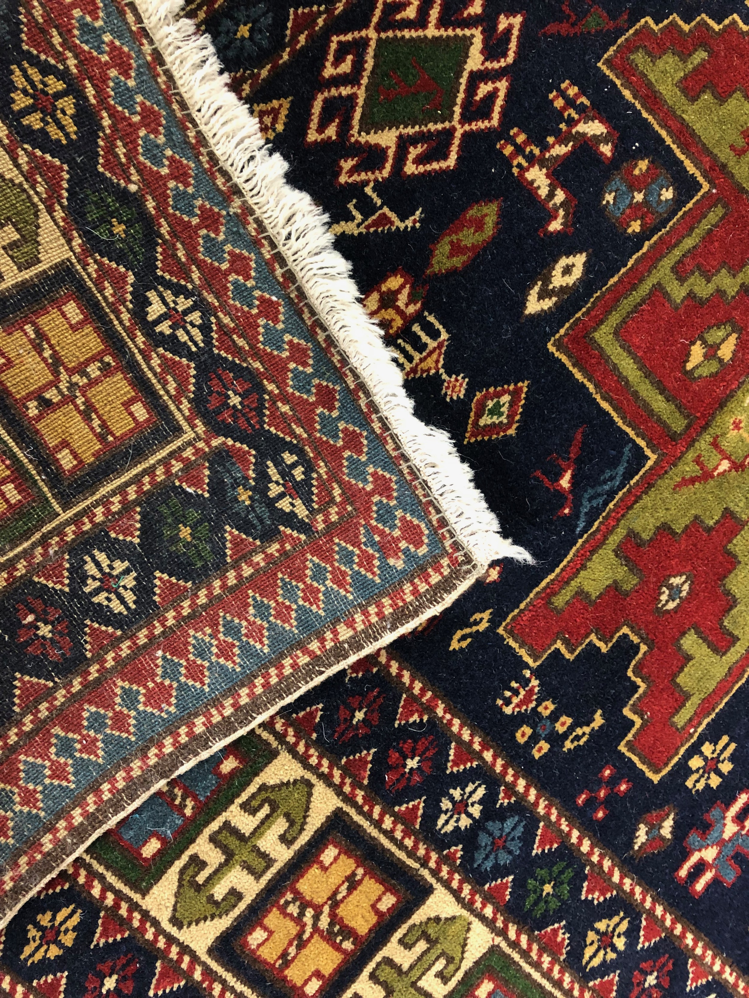 A Shirvan carpet with triple star medallions within stylised borders. L.192 W.129cm. - Image 3 of 3