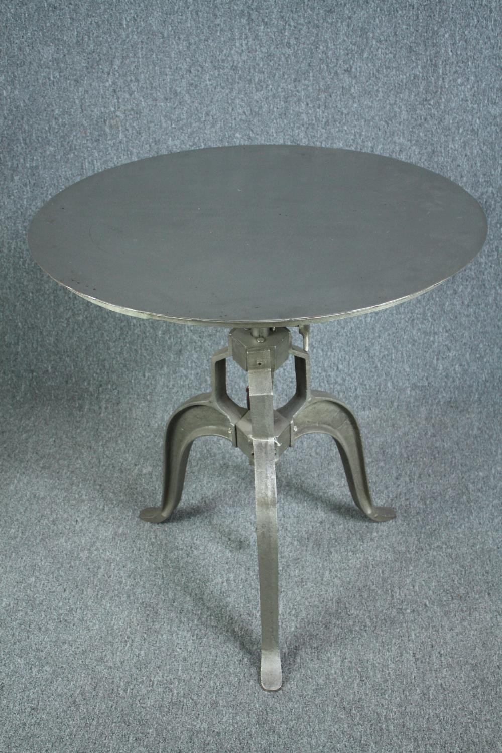 A metal industrial style table with hand winding rise and fall action. Dia.77cm. - Image 2 of 7