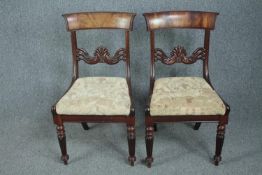 A pair of William IV mahogany dining chairs.