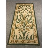 A hand woven tapestry wall hanging, stylised mimosa design in the manner of Voysey. L.217 W.102cm.