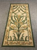 A hand woven tapestry wall hanging, stylised mimosa design in the manner of Voysey. L.217 W.102cm.