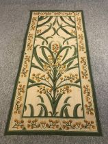 A hand woven tapestry wall hanging, stylised mimosa design in the manner of Voysey. L.217 W.102cm.