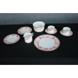 Wedgwood cups and saucers. A mixed collection made up of a creamer, sugar pot, side plates and