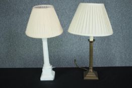 Two table lamps. Alabaster with a marble base and another brass example. Twentieth century. H.53 cm