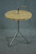 A contemporary industrial style occasional table. H.84 Dia.51cm.