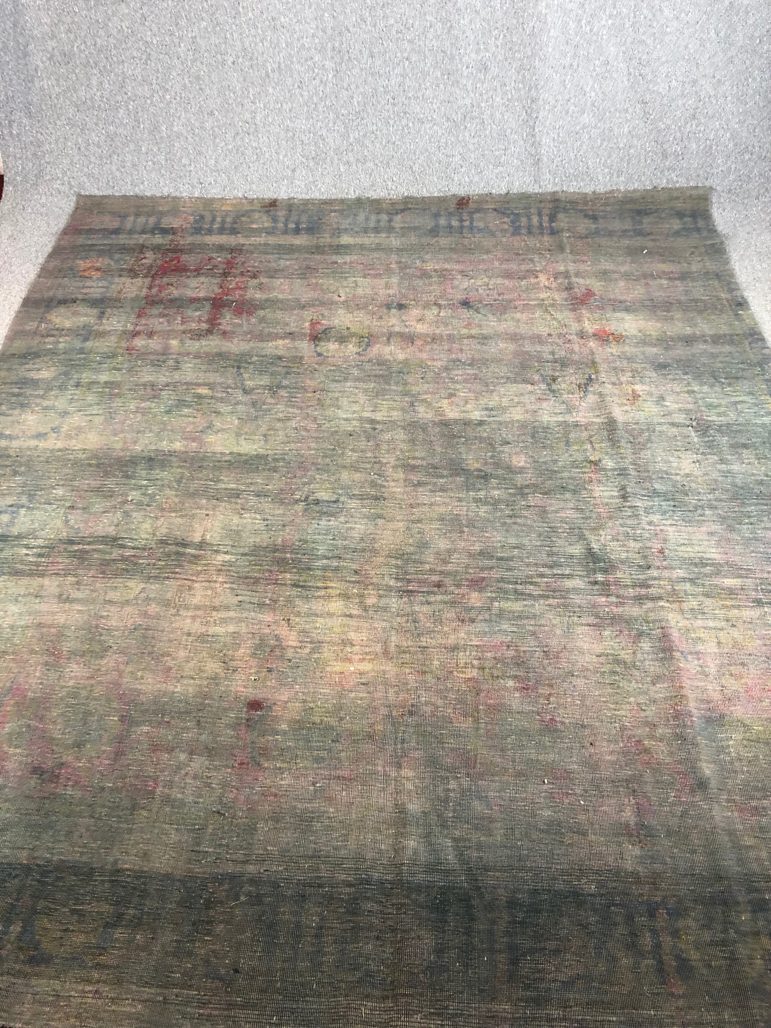 A hand woven Persian carpet. Faded. L.314 W.273cm.