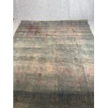A hand woven Persian carpet. Faded. L.314 W.273cm.