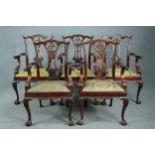 A set of five Chippendale style mahogany carver armchairs.