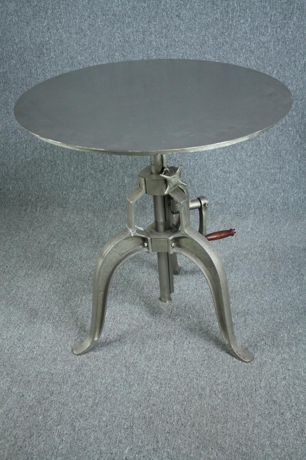 A metal industrial style table with hand winding rise and fall action. Dia.77cm. - Image 3 of 7