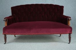 Sofa, early 19th century mahogany framed in deep buttoned upholstery. H.90 W.155 D.73cm.