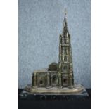 A brass church with steeple on a marble base. Twentieth century. H.34 cm.