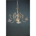 A brass chandelier with three branches of lights. H.50 Dia.57cm.