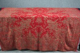 An early 20th century embroidered bed throw with multicoloured stylised scrolling pattern. L.170 W.