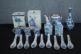 A mixed collection of blue and white Chinese porcelain including a teapot and vases. Signed on the