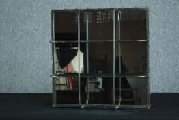 A contemporary industrial style metal framed mirror. H.60 W.60cm.