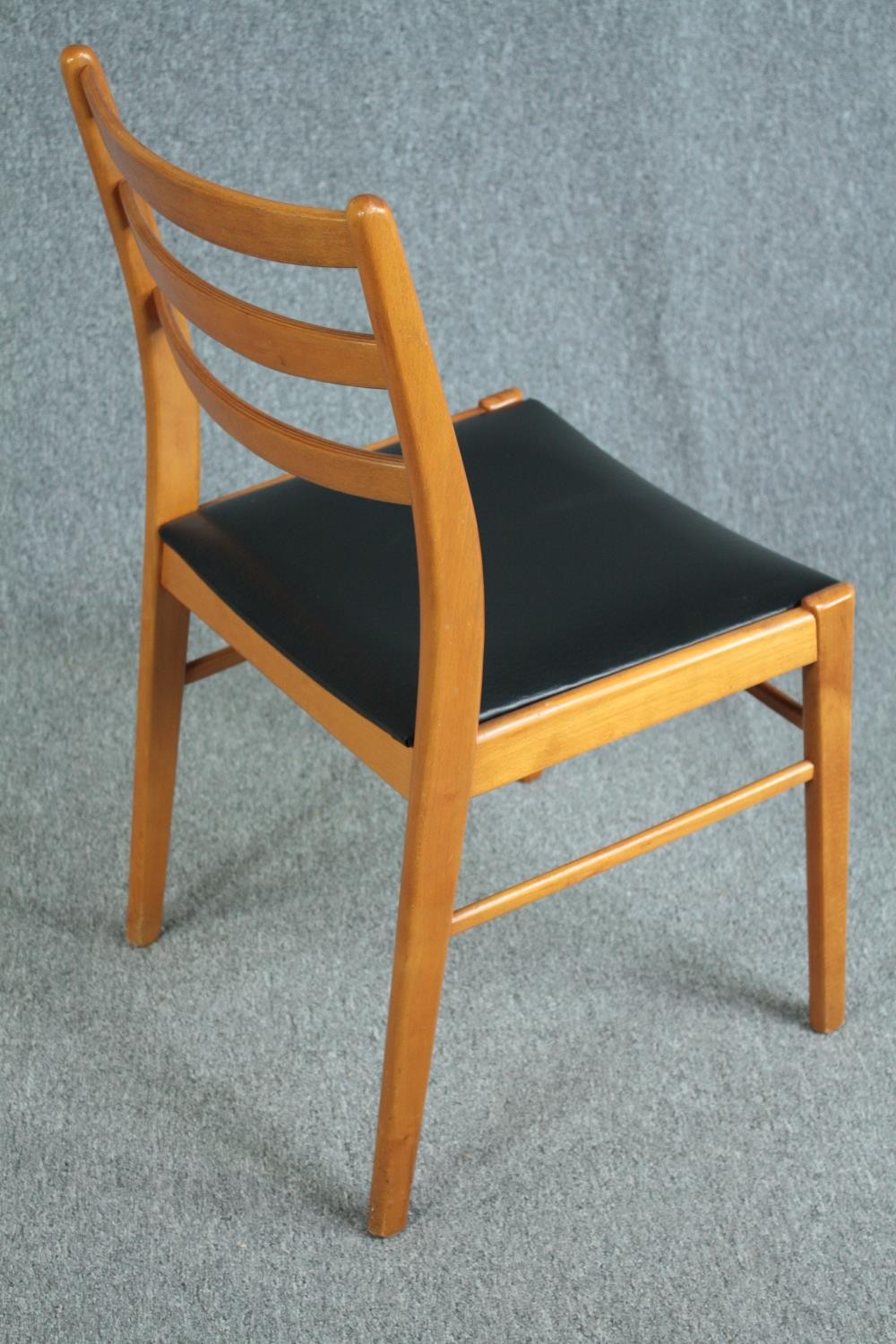 A set of six mid century vintage dining chairs in light beech and faux leather seats. - Image 4 of 5