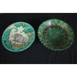 Two hand painted decorative plates with a wild boar and a chicken. Signed by the maker on the