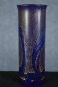 A blue glass oil slick vase with a gilt finish. Maybe Isle of White studio glass but without a