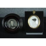 Two miniature printed portraits in ebonised frames. The gilt frame with a glass stand. H.14cm. (