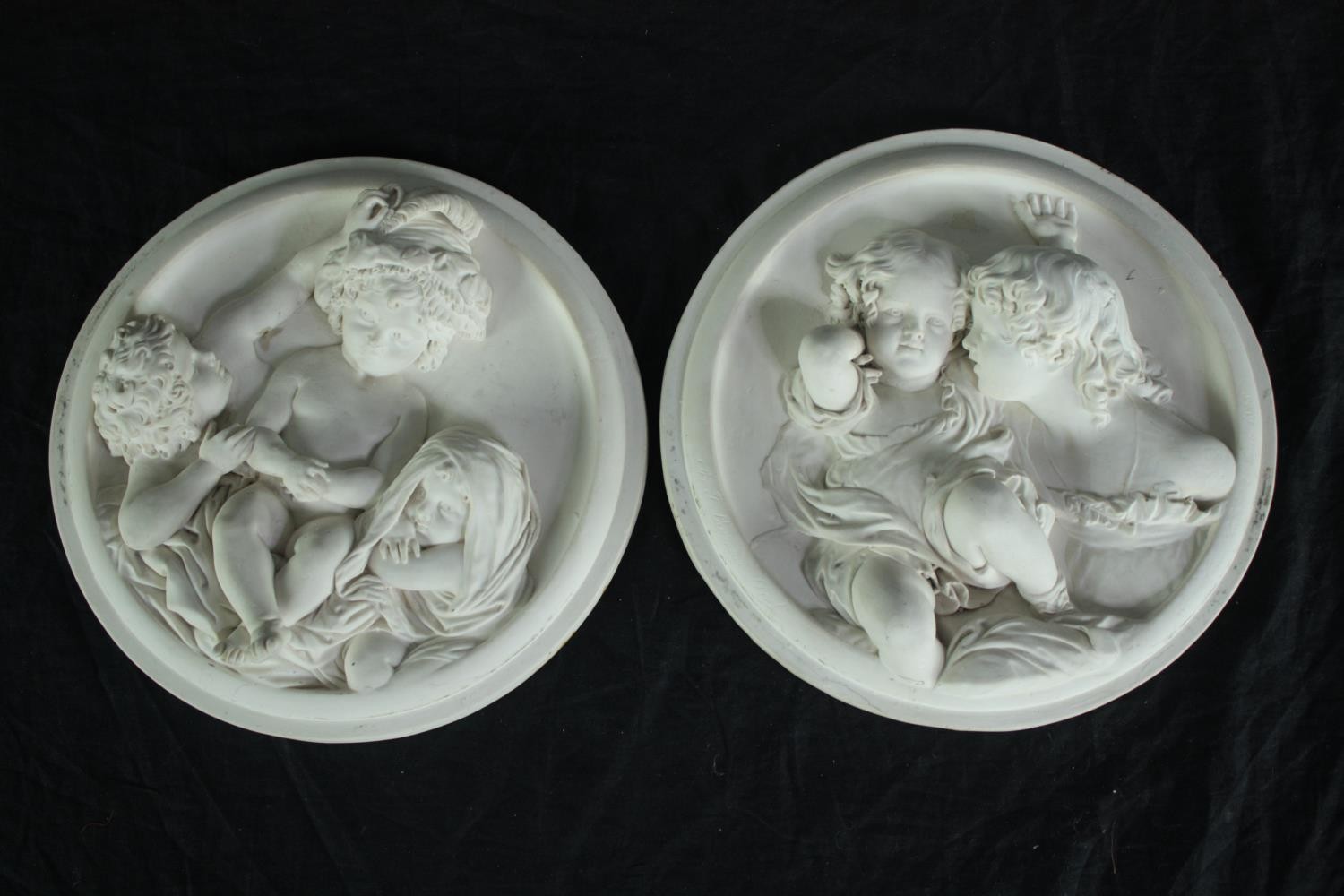 Edward William Wyon. Two modern plaster plaques. Cherubs. Dia.19cm. (each)