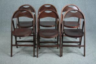 A set of six folding chairs from the Festival of Britain, each stamped to the underside.