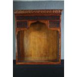 A North African style carved hardwood bookcase section. H.137 W.121 D.38cm.