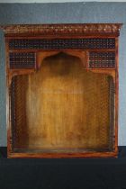 A North African style carved hardwood bookcase section. H.137 W.121 D.38cm.