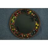 A vintage wall mirror with a garland of hand painted plaster fruit. Quite heavy. Twentieth