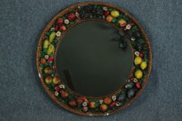 A vintage wall mirror with a garland of hand painted plaster fruit. Quite heavy. Twentieth