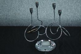 A pair of loop chromed candle holder and a vintage ashtray. H.28cm. (largest)